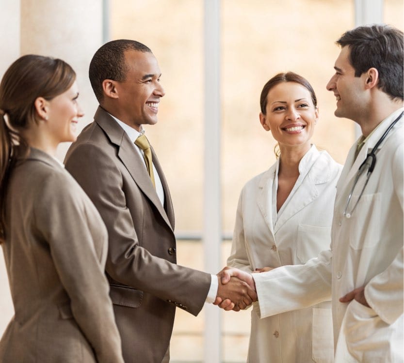 Businessman shaking hands with a doctor